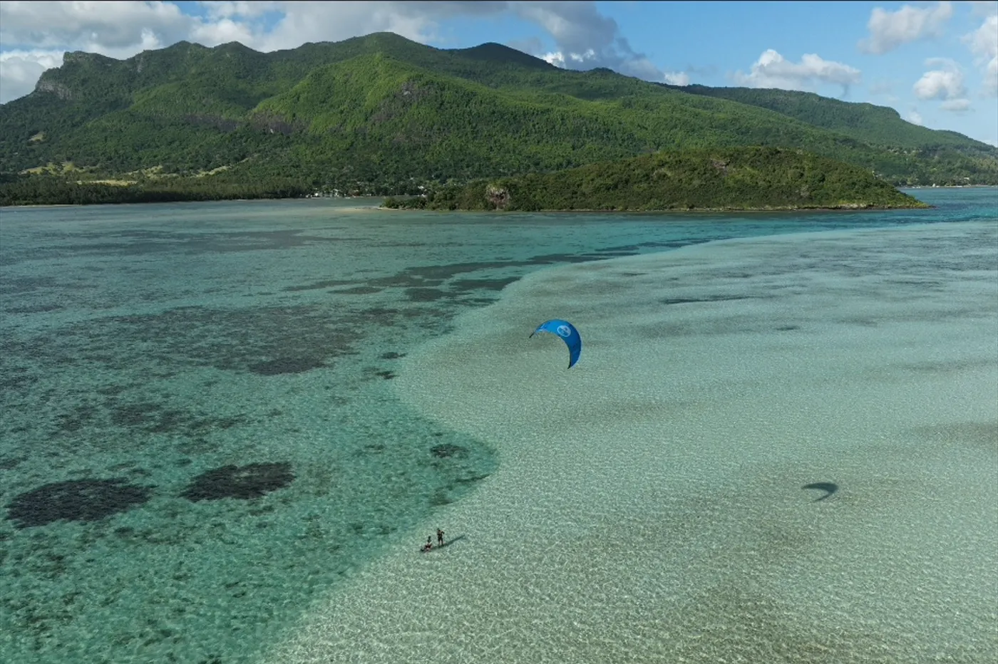 Le Morne landscape: green mountains above the clear turquoise lagoon of south-west Mauritius